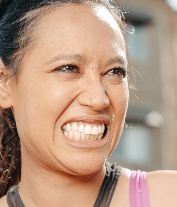 Woman feeling energetic and balanced in a bright space.